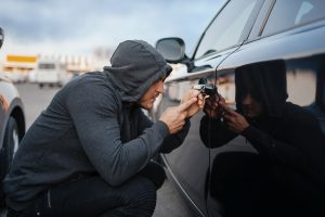 car thief with screwdriver breaking door lock 2021 08 27 09 36 10 utc